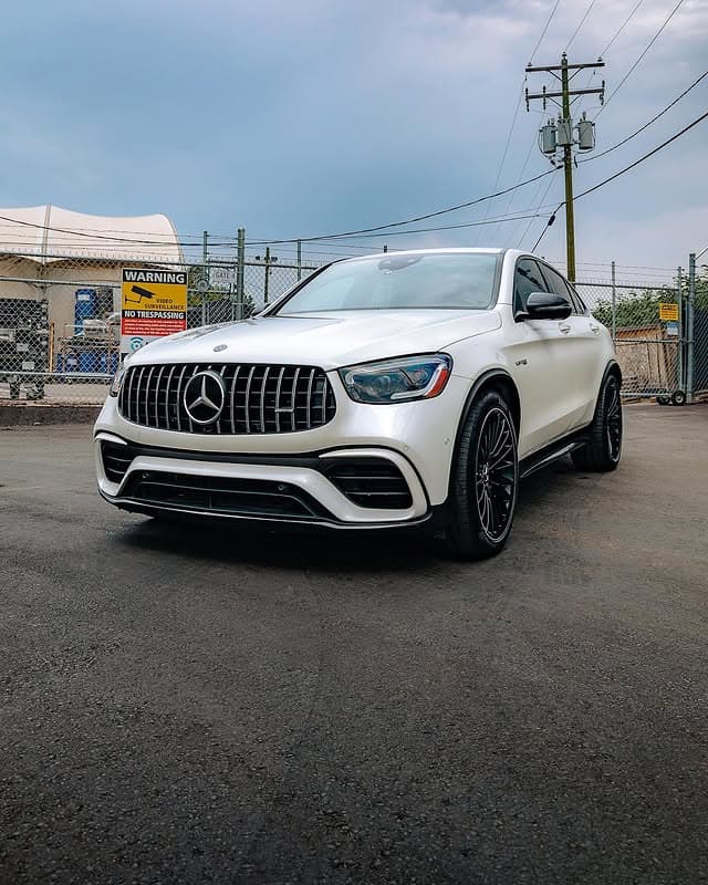 A ceramic-coated white Mercedes-AMG with a glossy, protected finish